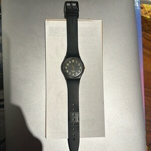 Women's black Swatch watch